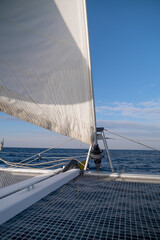 Obraz premium view from the bow of the catamaran yacht cruising by sea, Greece, Europe