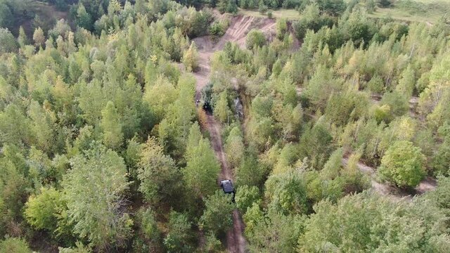 Aerial view of two 4x4 offroad cars on sandy road