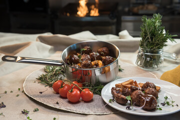 Stewed meatballs in cheese sauce