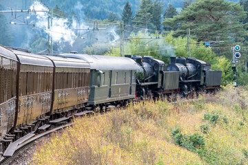 Fototapeta na wymiar Old fashioned train vagon of a Steam locomotive in the station of Brunico Brunek in Val Pusteria - Pustertal, Trentino Alto Adige, Südtirol - South Tyrol, Italy