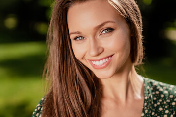 Fototapeta premium Photo of pretty cute cheerful glad lady beaming shiny smile wear green dress nature park garden outdoors