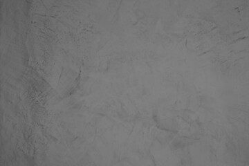 Ultimate Gray, Color of the year of 2021. The background texture of Venetian plaster in grey color. Decorative plaster on the wall in the interior in soft grey colors