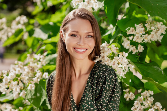 Photo of positive cheerful happy young woman smile spring good mood weekend enjoy outdoors outside park street