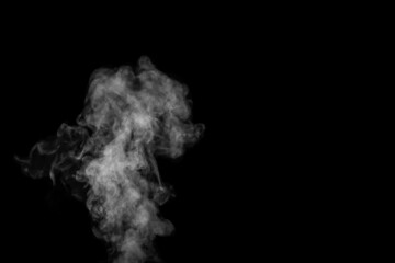 Fragment of white hot curly steam smoke isolated on a black background. Create mystical Halloween photos