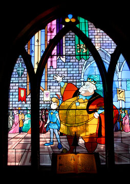 Stained glass window on the tale of Sleeping Beauty. Disney movie. Sleeping Beauty Story. Princess Castle at Euro Disney. Disney Land Paris. The magic of Disney. Dawn. Prince and King.