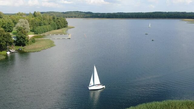 Aerial view of a sailboat on a lake in Masuria (Mazury) region in Poland, Europe
