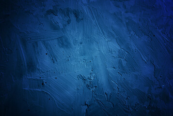 Dark blue grunge plaster texture background with rough strokes