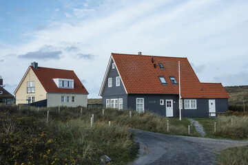 Fototapeta na wymiar Vacation home in the dunes of the Wadden island Vlieland on a sunny day in autumn