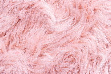 Pink fur texture top view. Pink sheepskin background. Fur pattern. Texture of pink shaggy fur. Wool texture. Sheep fur close up