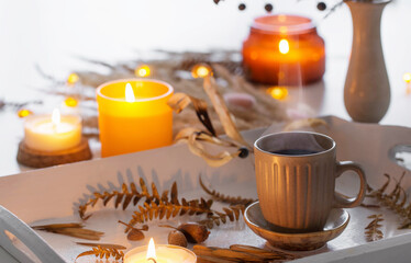 two cups of  coffee    and autumn decor on white wooden tray