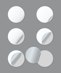 Blank white round paper stickers with curled corner