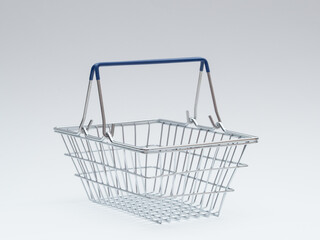 Empty Metal Shopping Basket on White Background