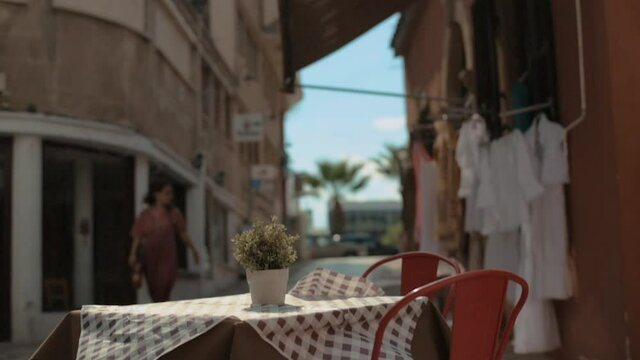 Empty table on terrace of small restaurant. Small and medium business in pandemic. Dynamic video. No visitors.
