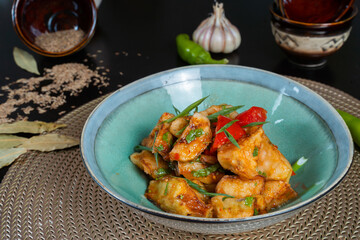 Salad with fried zucchini on a black background