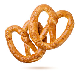 Two pretzels falling on a white background, bakery, oktoberfest. Isolated