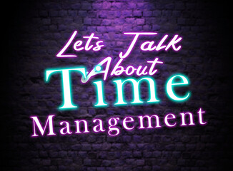 Let's talk About Time Management Neon Text sign. Glowing Bright lettering on dark brick wall background. Pink and Blue Neon effect. Time management discussion Concept 