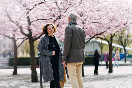 Mature couple standing in spring park