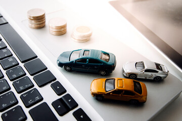 car and key on stacks of coin, car loan concept, Saving money for car concept, trade car for cash concept, finance concept.