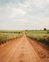 Foto op Plexiglas Beige Een onverharde boerderijweg in Shamrock, Texas