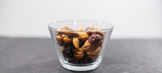 Small class of fresh nuts above black surface