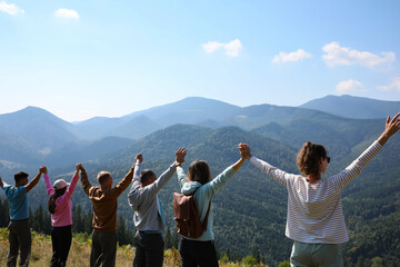 Group of people spending time together in mountains