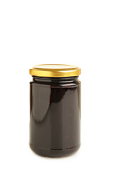 Plum jam in a glass jar isolated on white background