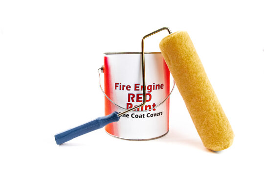 a gallon pail of enamel paint with a fake, generic, fire engine red paint label, with a paint roller laying against it isolated on white

