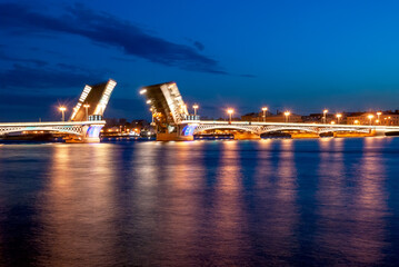 Fototapeta na wymiar St. Petersburg. Russia. Embankment of the Neva River. Drawbridge on white nights. Cityscape.