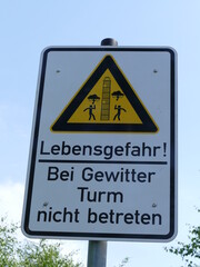 Warning sign "Danger to life! Do not enter the tower during a thunderstorm" in front of the Moehne Lake tower, Sauerland, North Rhine-Westphalia, Germany