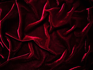 Red velvet fabric texture used as background. Empty red fabric background of soft and smooth...
