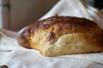 Homemade Bread on a linen favric close-up.  Sweet homemade bakery