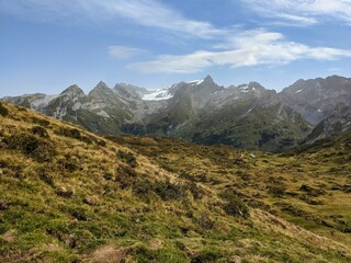 Fototapeta premium Hiking in Switzerland. View of the massive Glarnisch glacier in Glarus. Hiking through deep valleys to high mountains