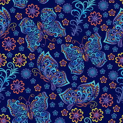 Naklejka premium Seamless pattern images of vivid openwork butterflies and flowers on dark blue background. Background for textiles, greeting cards, invitation cards, Wallpaper. Vector illustration.