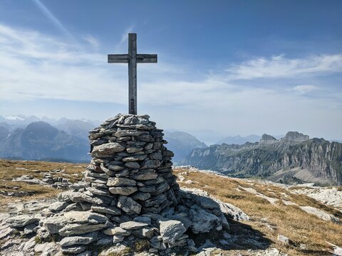 Summit cross on the Silberen mountain in the canton of Uri above the Pragelpass. Beautiful hiking and ski touring region