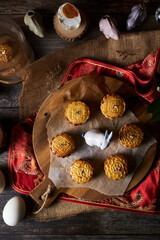 Mooncake a Chinese traditional pastry for Mid-Autumn festival. set on rustic wooden table.