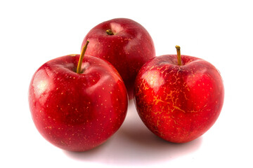 Three red apples isolated on white background.