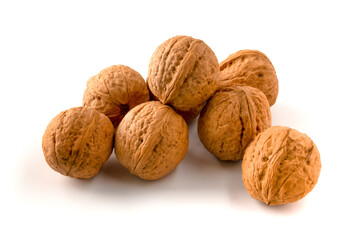 Whole walnuts isolated on white background.