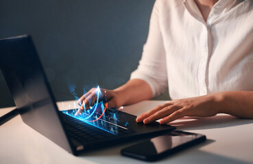 Business Woman analysing economic growth graph financial data on laptop. Stock market investment. Financial and banking Technology. Business strategy and digital marketing concept. 
