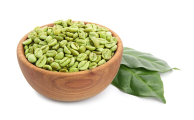 Wooden bowl with green coffee beans and fresh leaves on white background