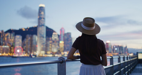 Woman traveler visit beautiful Hong Kong night view