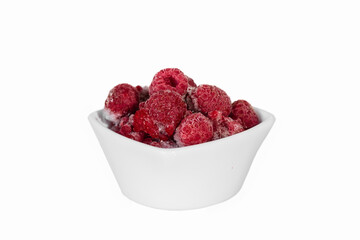 Frozen raspberries in a ceramic vase on a white background. Isolate.