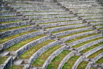 Seats of the ancient roman amphitheater in the city of Avenches, canton of Vaud, Switzerland