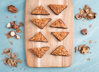 Nut corner, traditional german sweets called Nussecke, covered with chocolate