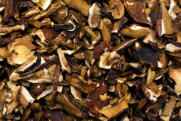 Natural organic dried mushrooms from the forest close-up background. Real healthy food.