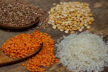 Cereals on a wooden background. Various cereals next to each other. Healthy diet
