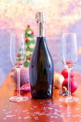 New year decoration with champagne and two flute glasses.
