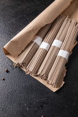 soba noodles buckwheat raw ready to cook meal snack on the table copy space food background 