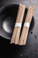 soba noodles buckwheat raw ready to cook meal snack on the table copy space food background 