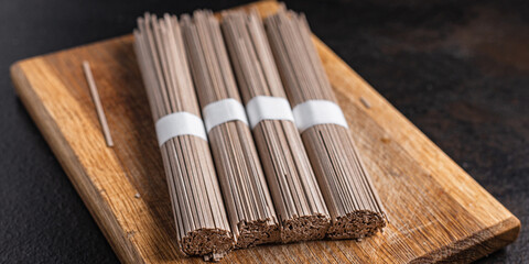 soba noodles buckwheat raw ready to cook meal snack on the table copy space food background 