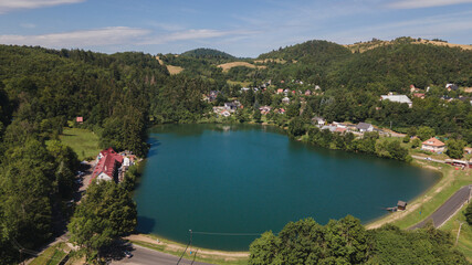 Aerial view of Vindsachtske lake in the village of Stiavnicke Bane in Slovakia